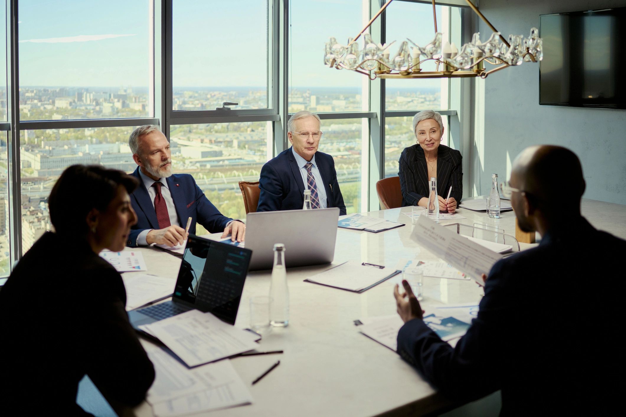 Business team reviewing portfolio plans in a boardroom
